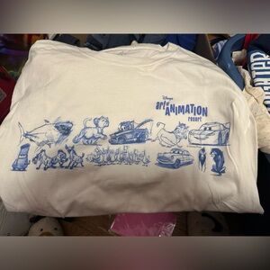 Disney Art of Animation Resort Cream and Blue Tee